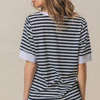 Contrast striped notched knit top, navy and ivory with V-neck and cuffed short sleeves.