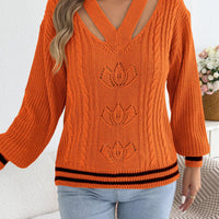 Orange V-neck cutout cable knit sweater, striped hem and cuffs