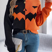Two-tone pumpkin face graphic sweater, orange/black zip-front knit, long sleeves