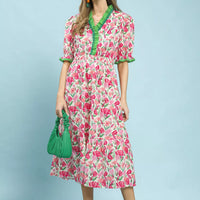 Floral tiered midi dress in pink mix with green trim, puff sleeves, and gathered tiers