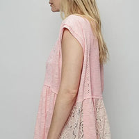 Blush pink lace peplum blouse with embroidered boat neck, cap sleeves—side view