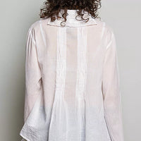 Ivory back view button-down shirt with pintuck seams and lace-trim hem