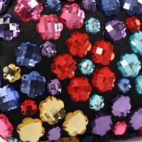 Crystal clutch bag surface with multicolor flower-shaped rhinestones