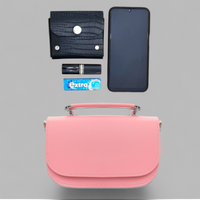 Pastel pink leather flap bag shown with phone and card for size