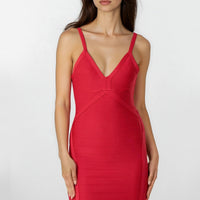 Red bandage dress with V-neck and slim spaghetti straps, fitted knee-length silhouette