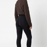 Black leggings with wide waistband, fitted ankle length.