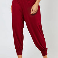 Wine harem trousers with elastic waist, tapered cuffed ankle
