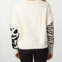 Ivory knit jumper, back view with spotted sleeve panels and ribbed neckline and hem