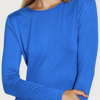 Royal blue round-neck long-sleeve top close-up on neckline and cuffs