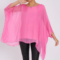 Pink silk batwing-sleeve top with rounded neckline, fluttery sleeve drape