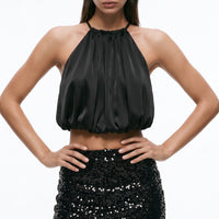 Black mini skirt with velvet-like base and allover sequins, fitted silhouette.