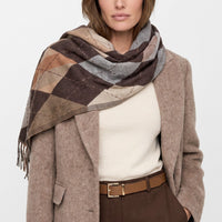 Brown argyle scarf with diamond check pattern and long fringed ends, draped around neck