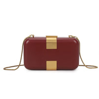 Burgundy evening clutch bag with gold-tone rectangular clasp and chain strap