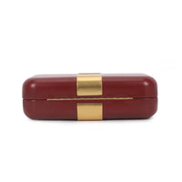 Burgundy evening clutch bag with gold-tone rectangular clasp on the top