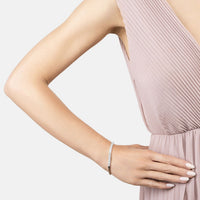 Silver tennis bracelet on a woman's wrist