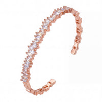 Rose gold ice cuff bangle with baguette-cut clear stones, open hinged design