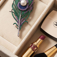 Peacock feather pearl brooch with large white pearl center and green purple beadwork
