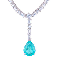Silver statement necklace with turquoise teardrop pendant and crystal link stations