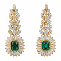 Gold gemstone drop earrings with emerald green center stones and crystal leaf details