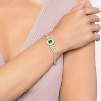Countess gemstone bracelet with emerald center and gold-tone stones