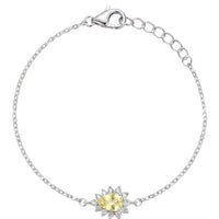 Silver bracelet with star-shaped charm and oval yellow gemstone