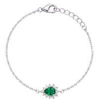 Silver bracelet with emerald-green oval center gemstone and starburst setting