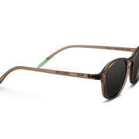 Brown round sunglasses, angled side view, dark lenses with green temple accents
