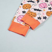 Pink pumpkin print pajama shorts with contrast orange hem