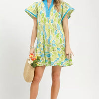 Green and blue leaf print tiered mini dress with flutter sleeves, full body view
