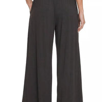 Black smocked-waist wide-leg palazzo pants with straight wide legs