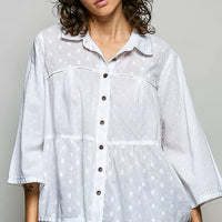 Off-white button-front shirt with tonal dot texture and relaxed collar