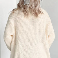 Off-white knit cardigan sweater with crew neck and full buttonless front.