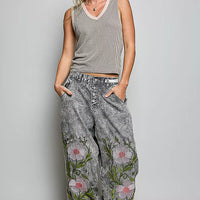 Light grey ribbed V-neck sleeveless tank with contrast trim, front view on model.