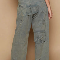 Distressed wide-leg denim pants, patchwork panels, raw frayed hem