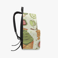 Kids canvas backpack side view with black webbing strap and green food pattern