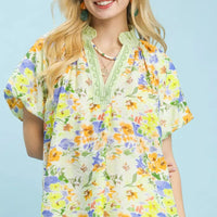 Green watercolor floral blouse with keyhole V-neck and short puff sleeves