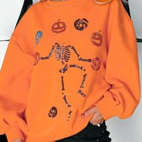 Orange sweatshirt with Halloween skeleton and pumpkin graphic, crewneck, long sleeves