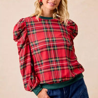 Red plaid blouse with puff sleeves, exaggerated shoulders, and green ribbed crew neckline
