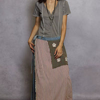 Grey pinstripe short sleeve top with V-neck and stitch seam detail, front view