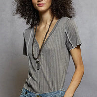 Grey pinstripe V-neck short sleeve top with stitch seam detail, three-quarter view