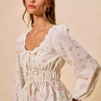 White floral clip-dot lace-trim ruched bodice blouse with long puff sleeves and peplum hem