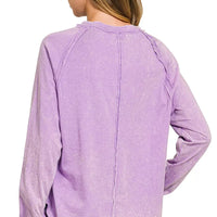 Lavender washed long-sleeve top with round neck and center back seam
