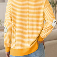 Yellow and white striped long-sleeve top, round neck, back view