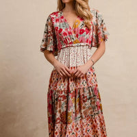 Floral print tiered midi dress with V-neck and ruffled bodice, gathered waist
