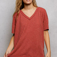 Terra cotta ribbed knit V-neck short sleeve t-shirt with relaxed drape