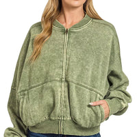 Olive acid-washed fleece zip jacket with ribbed collar, cuffs, hem, and front pockets