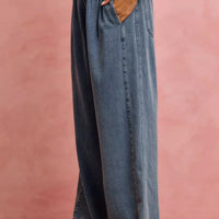 Denim wide-leg jeans with ruffled elastic waistband, side pocket, and straight wide leg