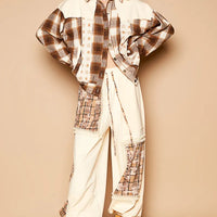 Beige plaid star patchwork shacket worn over light pants and tan boots