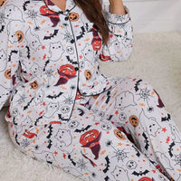 Plus size Halloween pajama set in white with ghost, pumpkin, and bat allover print