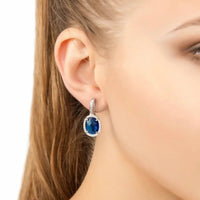 Silver drop earrings with blue oval gemstone and crystal halo